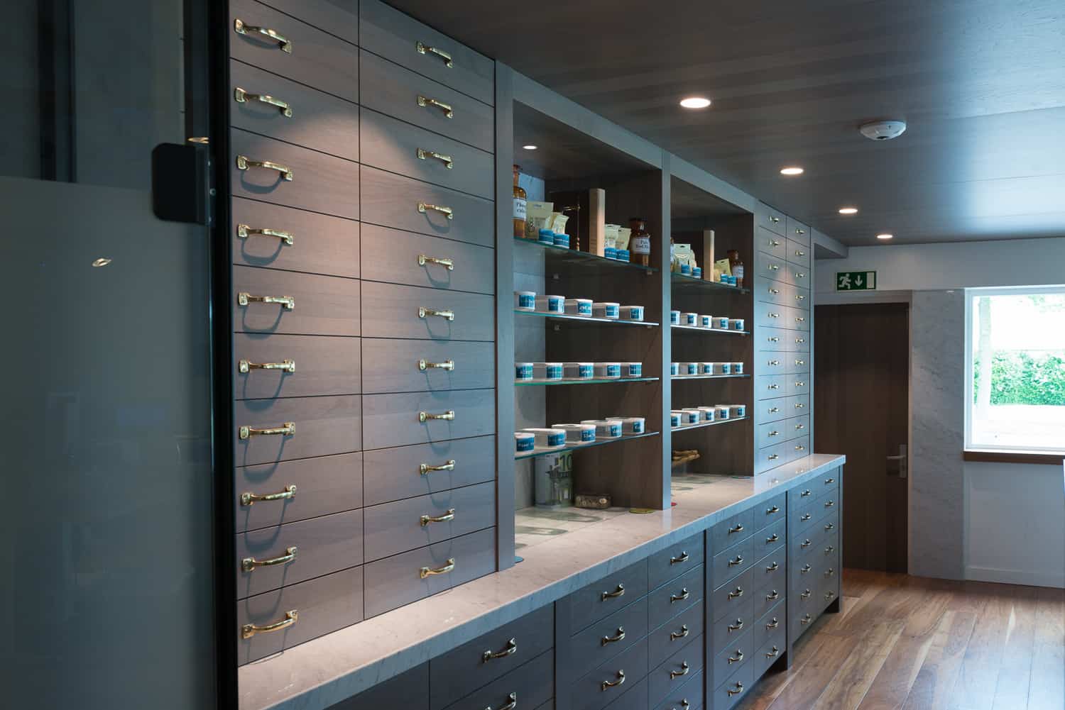 Modern Pharmacy styled counter at the Blue Tomato Coffeeshop in Hoorn